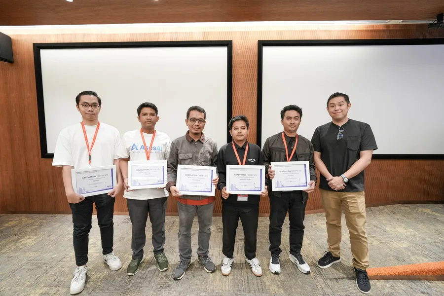Graduates of the cohort holding their certificates