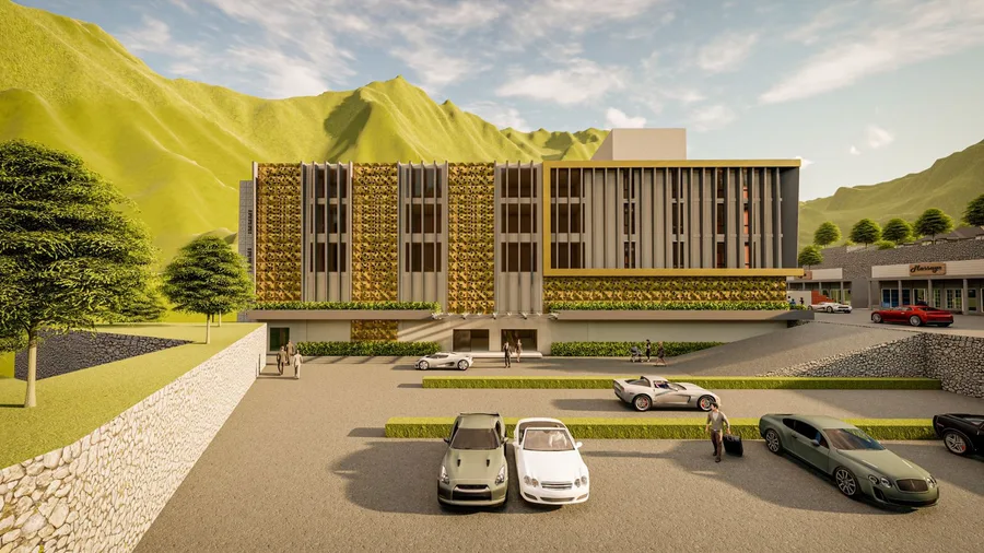 Front of the four-storey hotel block with its car park and stone retaining walls